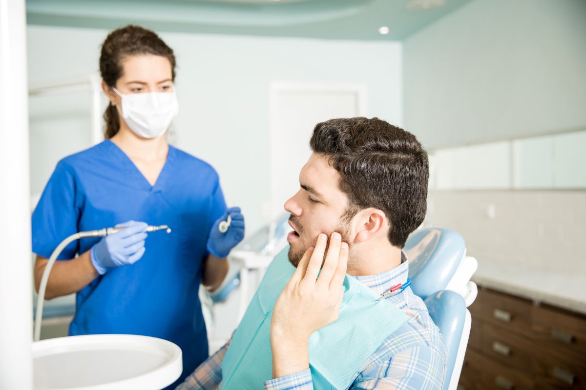 Patient with a knocked-out or loose tooth receiving care