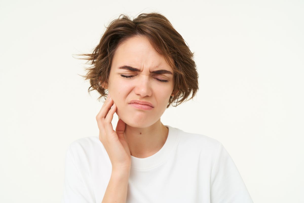 Patient experiencing facial swelling before emergency extraction