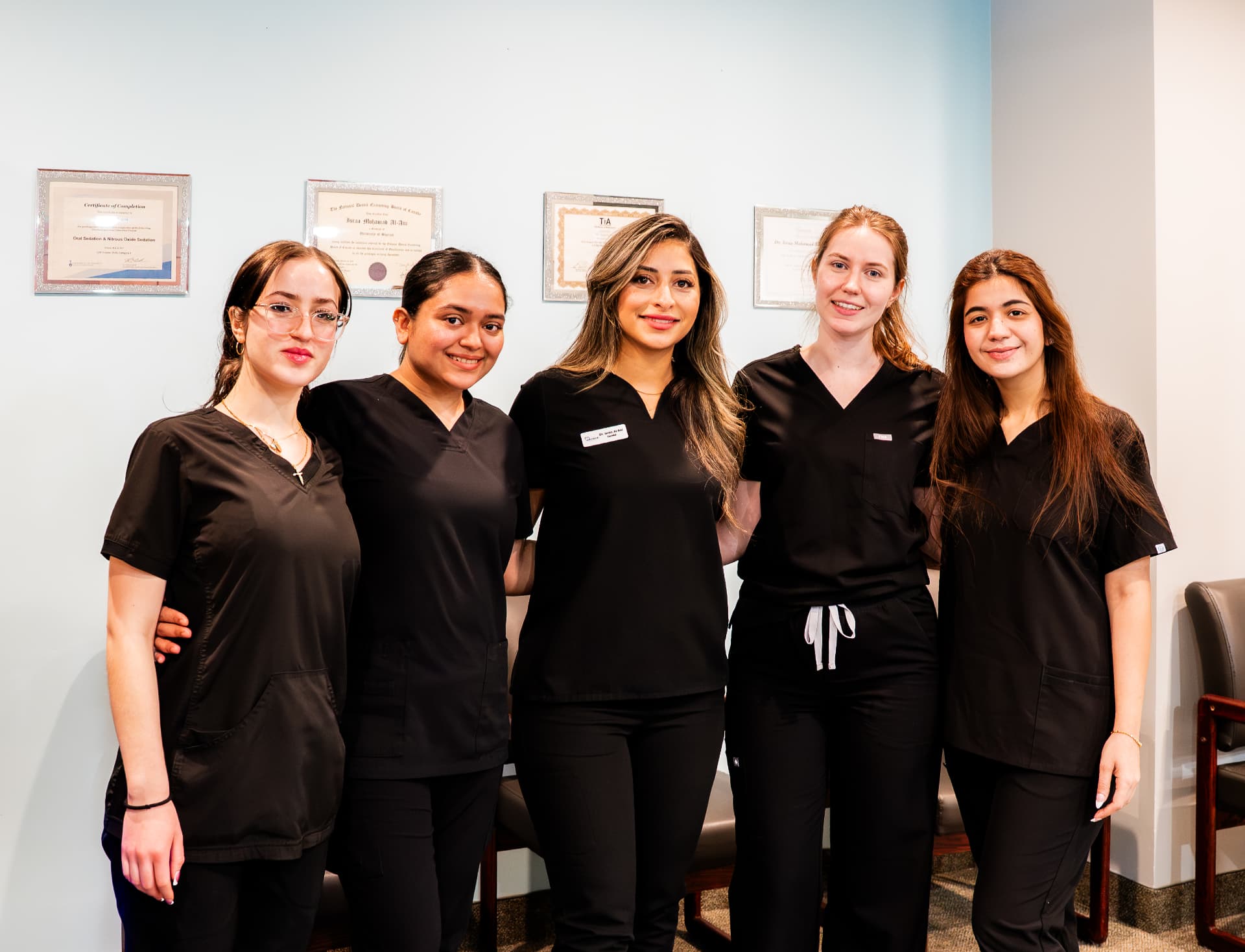 Westmount Dental staff with professional certificates
