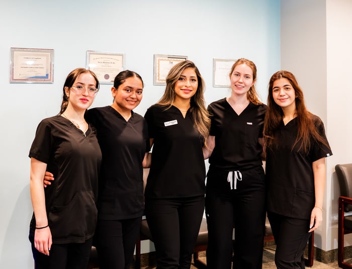 Westmount Dental staff with professional certificates