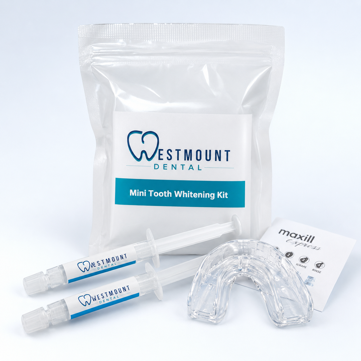Complimentary Westmount Dental take-home teeth whitening kit with gel syringes and mouth tray